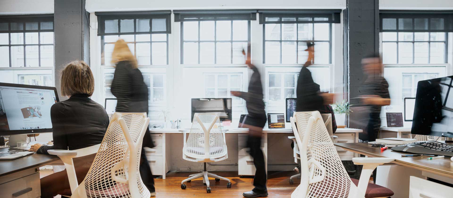 People moving and working in the Amplified offices in Portland, OR